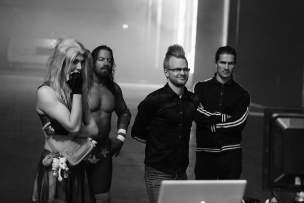 My movie rival, transsexual wrestler Jessica Love, looks on at the filmed segments between takes with writer ilja Rautsi and director Oskari Pastila.