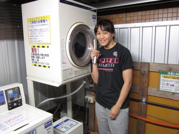 Former WNC Women's Champion Syuri washes some midnight laundry in Osaka.