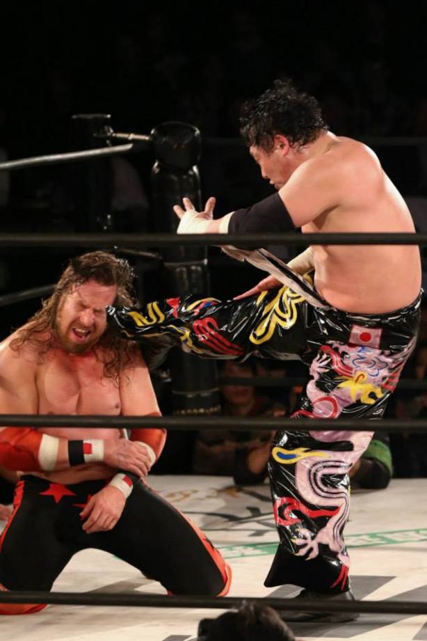 Tajiri kicks awat at me (photo by Yuichi Kojima)