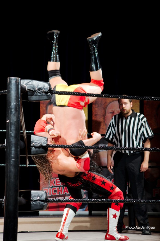 Butterfly double-underhook suplex plants Vandamme for a nearfall.